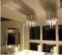 Lampadario “High tech falls”.<br />Materiale: alluminio.<br />Finitura: spazzolato.<br />Illuminazione: led